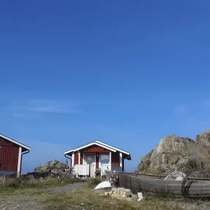Row of colorful wooden vacation home in the middle of nature in Sweden