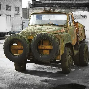 Rusry vintage car standing in the yard Rusry vintage car standing in the yard