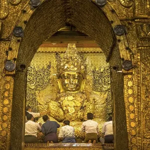 Saint golden Buddha in Mahamuni Pagoda Saint golden Buddha in Mahamuni Pagoda