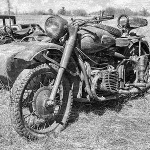 Samara, Russia - April 30, 2017: Russian vintage rusty motorcircle at the field in sunny day Samara, Russia - April 30, 2017: Russian vintage rusty motorcircle at the field in sunny day