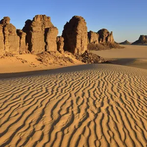 Sanddunes and rock towers in Tiou Tatarene Sanddunes and rock towers in Tiou Tatarene
