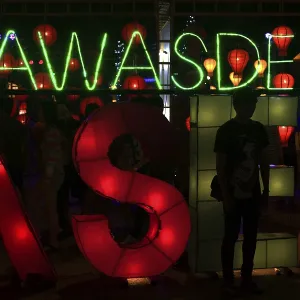 "Sawasdee" lettering in neon lights