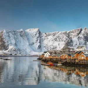 Scandinavian landscape with boathouses at the fjord Scandinavian landscape with boathouses at the fjord