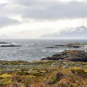 Scenic view of the Beagle Channel with rocky islands and snow-capped mountains Scenic view of the Beagle Channel with rocky islands and snow-capped mountains