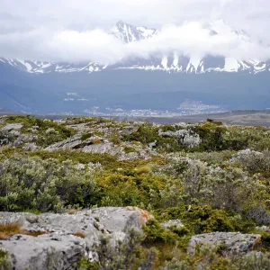 Scenic view of rocky ground and snow-capped mountains in Ushuaia