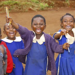 School children, 7, wearing school uniforms and looking forward to attending primary school