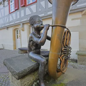 Sculpture boy with tuba by Guido Messer 1991 Sculpture boy with tuba by Guido Messer 1991