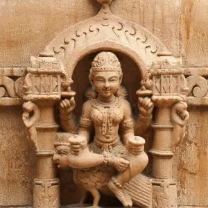 Sculpture of goddess chakreshwari sitting on a eagle on the wall of panchasara parasvanath jain temple Sculpture of goddess chakreshwari sitting on a eagle on the wall of panchasara parasvanath jain temple