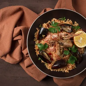 Seafood paella, shrimp and mussels risotto