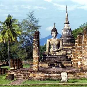 Seated Buddha at Wat Mahathat, temple ruins Seated Buddha at Wat Mahathat, temple ruins