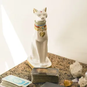 Set of a tarot reader on a table featuring various tarot decks Set of a tarot reader on a table featuring various tarot decks
