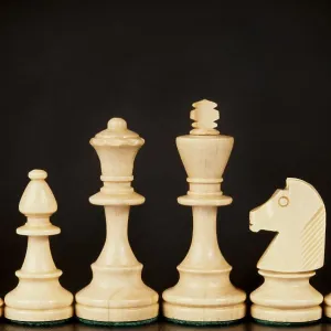 A set of wooden chess pieces including a king