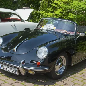 Shiny black vintage sports car at a car show