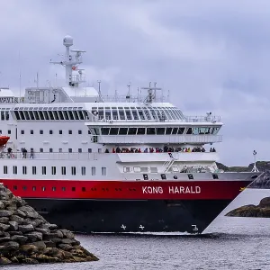 Ship Kong Harald of Hurtigruten company is approaching harbor of Stamsund Ship Kong Harald of Hurtigruten company is approaching harbor of Stamsund