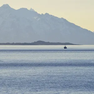 Ship in the Sortlandsund in front of the mountains Ship in the Sortlandsund in front of the mountains