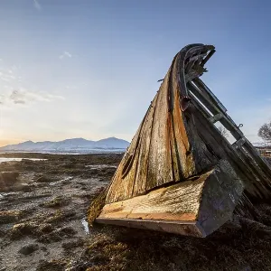 Shipwreck at sunrise and low tide at the peninsula Tisnes Shipwreck at sunrise and low tide at the peninsula Tisnes
