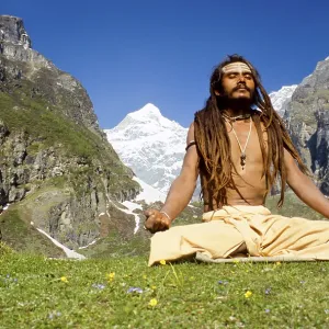Shiva sadhu meditating next to his cave high above Badrinath Shiva sadhu meditating next to his cave high above Badrinath