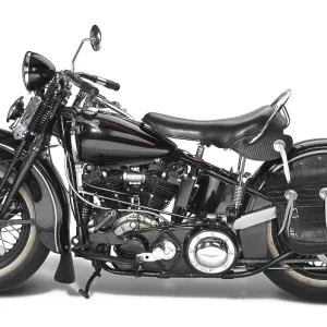 Sideways shot of a vintage motorbike in white back