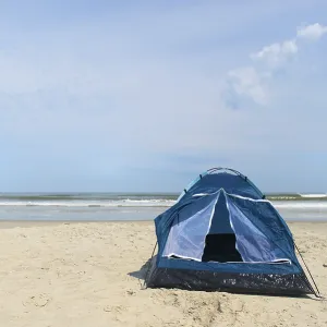 Single tent for camping in shelter at the beach Single tent for camping in shelter at the beach
