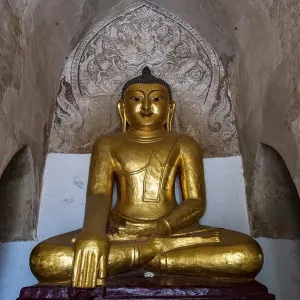 Sitting buddha in the Manuha temple, Bagan, Myanmar, Asia Sitting buddha in the Manuha temple, Bagan, Myanmar, Asia