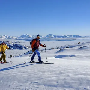 Ski mountaineer on ski tour, back pack ice