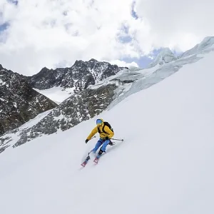Ski tourers descending Alpeiner Ferner Ski tourers descending Alpeiner Ferner