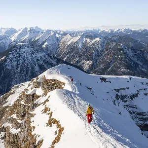 Two ski tourers at the summit of Schafreuter