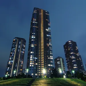 Skyscraper buildings with night illumination inside modern Tokyo