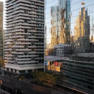 Skyscrapers with glass facades reflecting sunset colors in a city environment in Toronto Skyscrapers with glass facades reflecting sunset colors in a city environment in Toronto