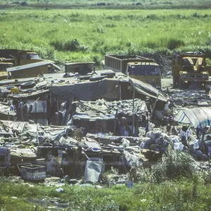 Slum, slum in a swamp area next to a main road