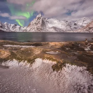 Small aurora with clouds, rocks and ice