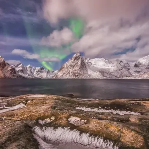 Small aurora with clouds, rocks and ice