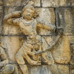 Small figure of a female archer carved on the wall in the Borobudur temple in Java Small figure of a female archer carved on the wall in the Borobudur temple in Java