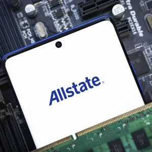 Smartphone with logo allstate insurance company on paper policy and money currency Smartphone with logo allstate insurance company on paper policy and money currency