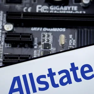 Smartphone with logo allstate insurance company on paper policy and money currency Smartphone with logo allstate insurance company on paper policy and money currency