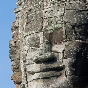 The smile of Angkor, huge face carved in stone on a tower