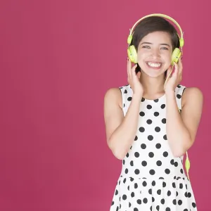 Smiling woman listening to music on headphones Smiling woman listening to music on headphones