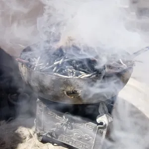 Smoke sticks burning in a bowl as a sacrifice Smoke sticks burning in a bowl as a sacrifice