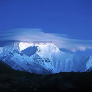Snow-covered Mount Everest, 8850m, Nepali or Tibetan Sagarmantha Chomolungma, seen from the basecamp from the Tibetan direction, north side, full moon night, Rongbuk, Tibet, China, Asia