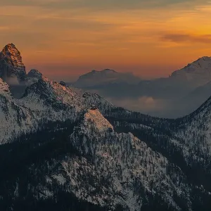 Snow-covered mountain peaks of the Bosconero group at sunset