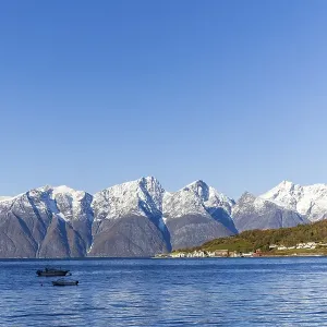 Snow-covered mountains at Lyngen Fjord Snow-covered mountains at Lyngen Fjord