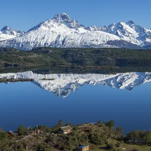 The snow-covered Mt. Cerro Castillo is reflected in a lake