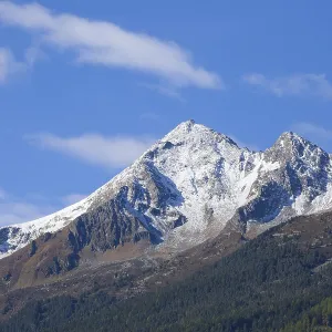 Snowy mountain Brennerspitze in autumn