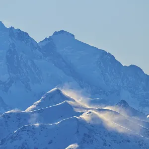 Snowy mountain peaks backlit with snow Snowy mountain peaks backlit with snow