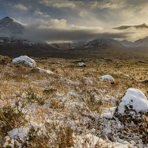 Snowy mountain tops of Ben Lee with clouds in Highland landscape