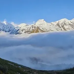 Snowy Mountains above the clouds at Hochalpenstrasse Snowy Mountains above the clouds at Hochalpenstrasse