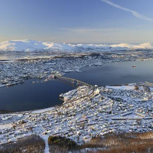 Snowy town with bridge, islands in the North Sea
