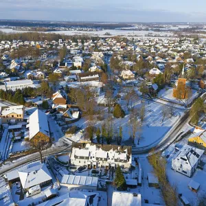 Snowy town view with many houses