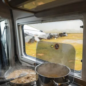Spaghetti with creamy cream sauce cooked on gas stove in Campervan Spaghetti with creamy cream sauce cooked on gas stove in Campervan