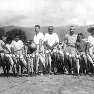 Sport fishermen present their catch